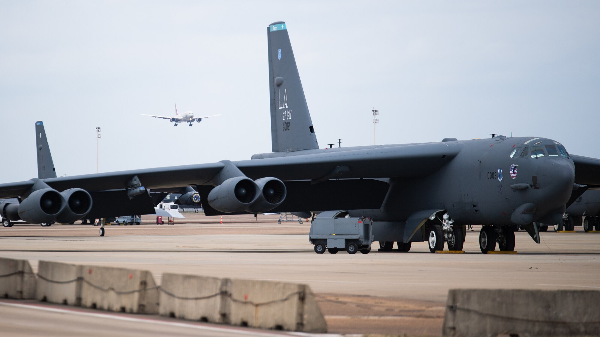 A plane carrying Airmen from the 2nd Bomb Wing returns to Barksdale Air Force Base, La., Feb. 24, 2021, after a Bomber Task Force deployment to Andersen Air Force Base, Guam. The 2nd BW routinely conducts BTFs, working with allies and partners to ensure lethality and familiarity in various regions. (U.S. Air Force photo by Airman 1st Class Jacob B. Wrightsman)