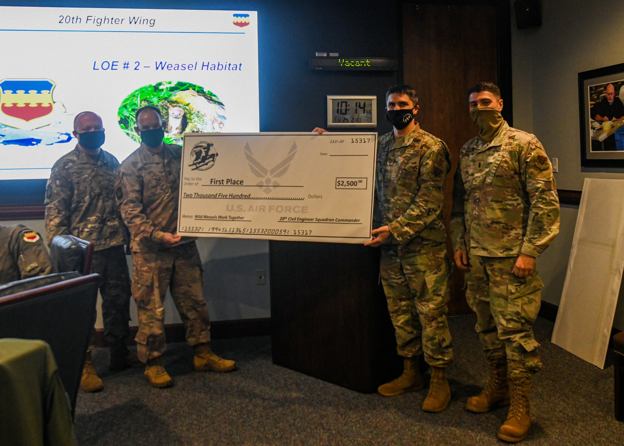 Photo of Airmen standing for a photo