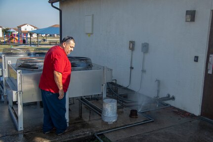 Eddie Granados, a plumber with the 502nd Civil Engineer Squadron, evaluates damages at Joint Base San Antonio–Fort Sam Houston, Texas, Feb. 19, 2021.
