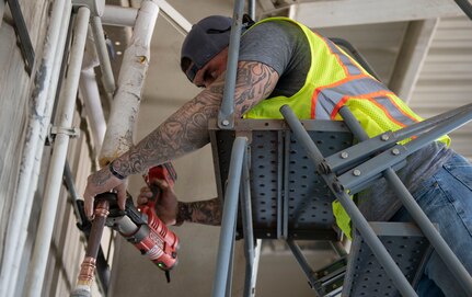 Hector Salinas, a contract plumber assigned to the 502nd Civil Engineering Squadron, clamps a new pipe adjustment to repair a water leak at Joint Base San Antonio-Randolph, Feb. 23, 2021.