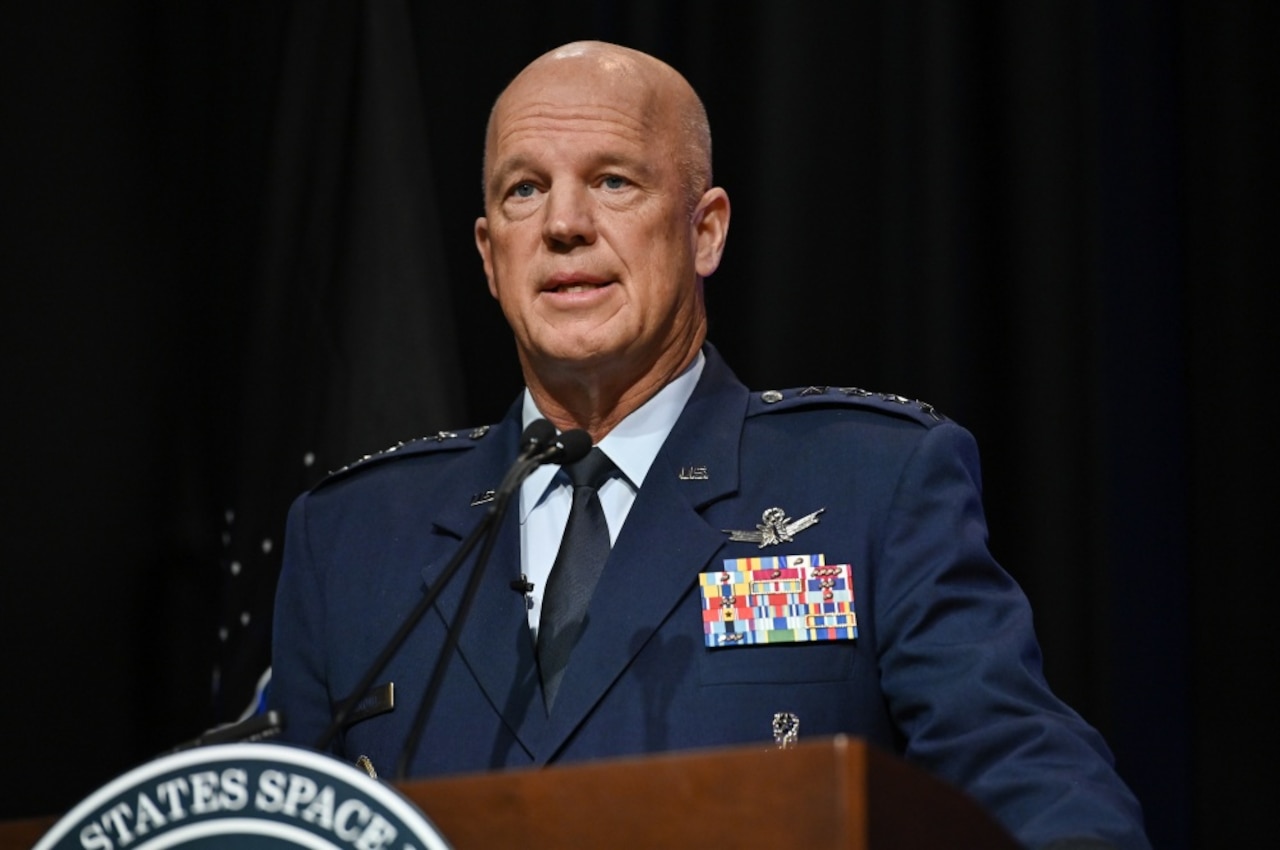 A man in a military uniform speaks.