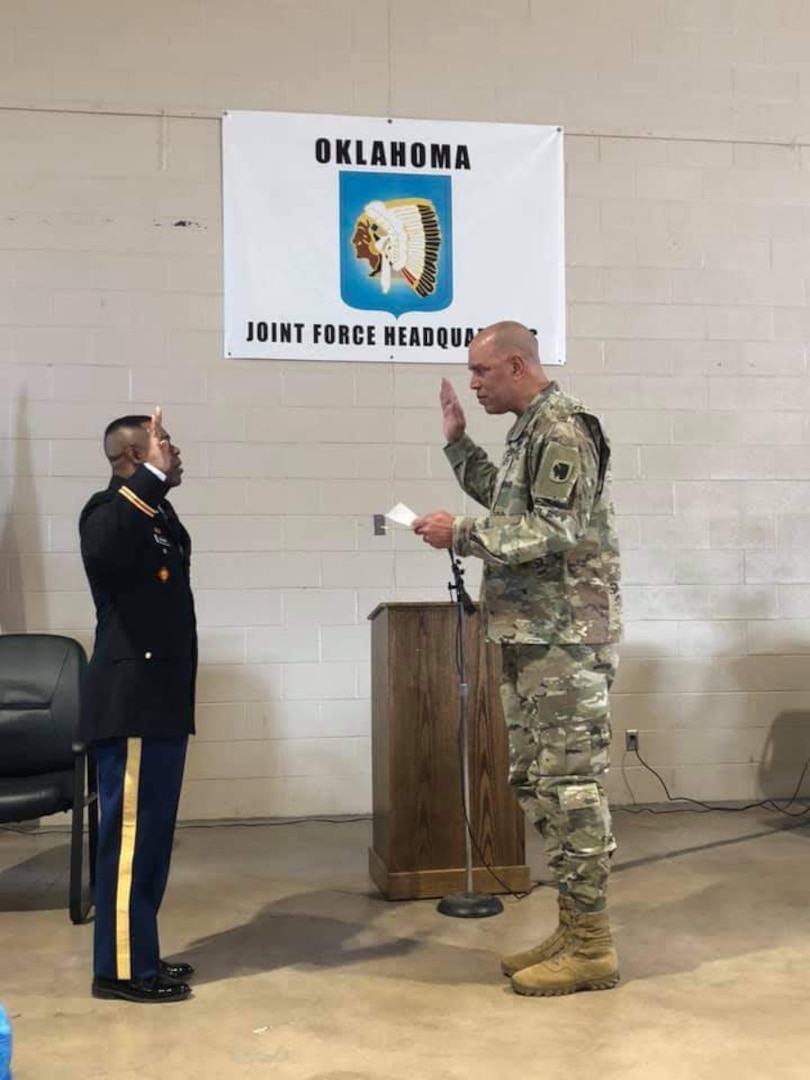 Second Lt. Bennie Brown (left) is sworn-in as an Army officer by Maj. Gen. Michael Thompson (right), the adjutant general for Oklahoma, during his commissioning ceremony at the Oklahoma National Guard Joint Force Headquarters in Oklahoma City, April 3, 2019. Brown is the oldest African American officer and one of the oldest officers ever to graduate the engineer officer course at Fort Leonard Wood, Missouri. (photo illustration provided by 2nd Lt. Bennie Brown)
