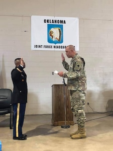 Second Lt. Bennie Brown (left) is sworn-in as an Army officer by Maj. Gen. Michael Thompson (right), the adjutant general for Oklahoma, during his commissioning ceremony at the Oklahoma National Guard Joint Force Headquarters in Oklahoma City, April 3, 2019. Brown is the oldest African American officer and one of the oldest officers ever to graduate the engineer officer course at Fort Leonard Wood, Missouri. (photo illustration provided by 2nd Lt. Bennie Brown)