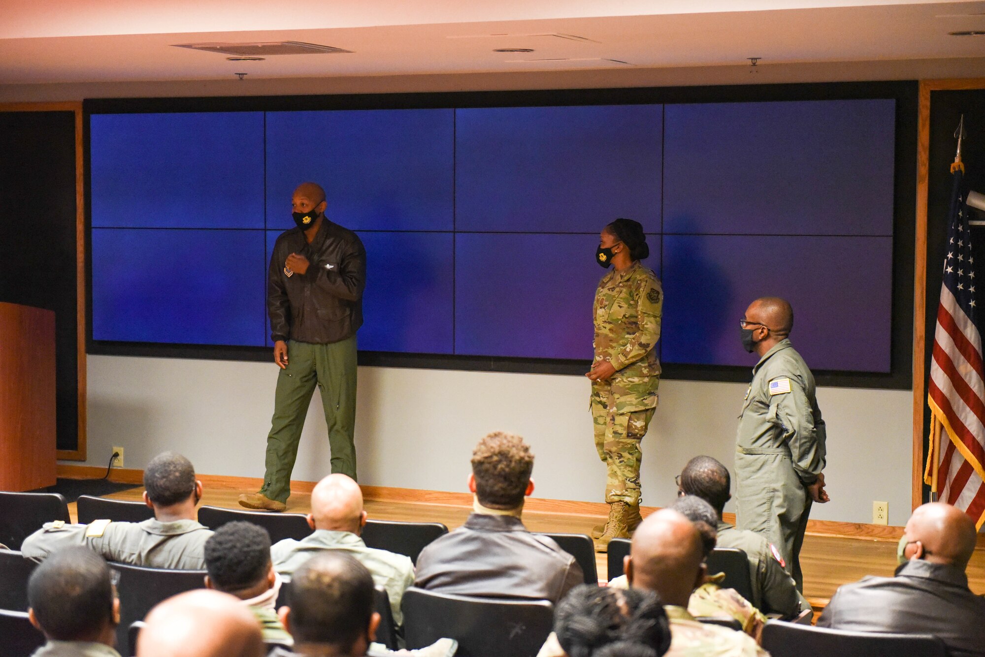 Col. Jaron H. Roux, 437th Airlift Wing commander, and Chief Master Sgt. Charmaine N. Kelley, 437th Airlift Wing command chief master sergeant, Joint Base Charleston, greet a room of black enlisted Airmen on Joint Base Charleston, S.C., Feb. 19, 2021. Black Airmen from six different Air Force installations were invited to Joint Base Charleston for an event honoring the contributions and heritage of black Airmen for Black History Month. (U.S. Air Force photo by Senior Airman Mikayla Heineck)
