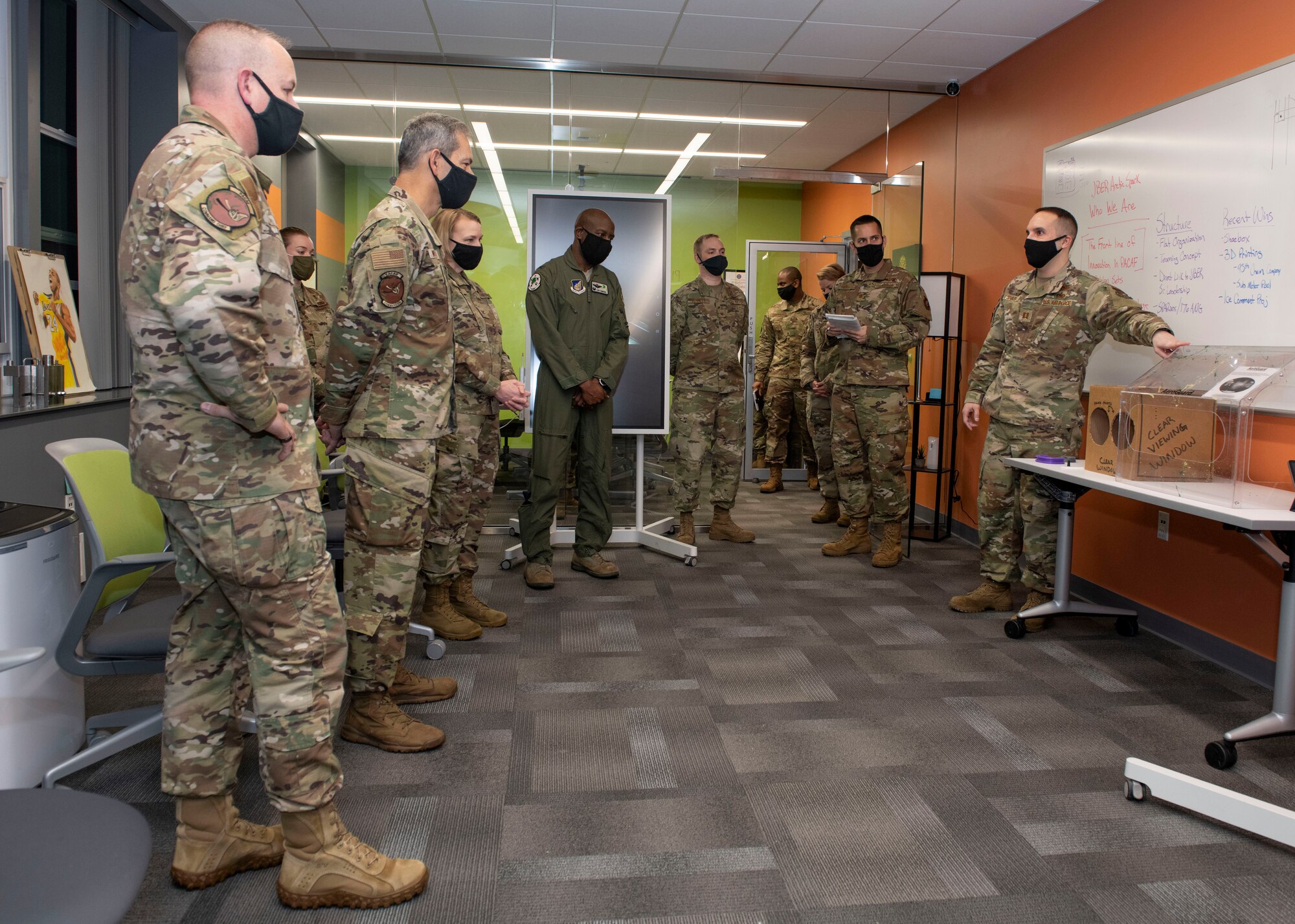 U.S. Air Force Capt. Jamey Schuls, the 773d Logistics Readiness Squadron director of operations, briefs Pacific Air Forces leadership on the Joint Arctic Spark Lab and continuing innovation projects at Joint Base Elmendorf-Richardson, Alaska, Feb. 18, 2021. PACAF leadership conducted an immersion tour of JBER to learn about the installation's role in readiness and defense in the Arctic as well as how the base remains poised for the future through innovative ideas.