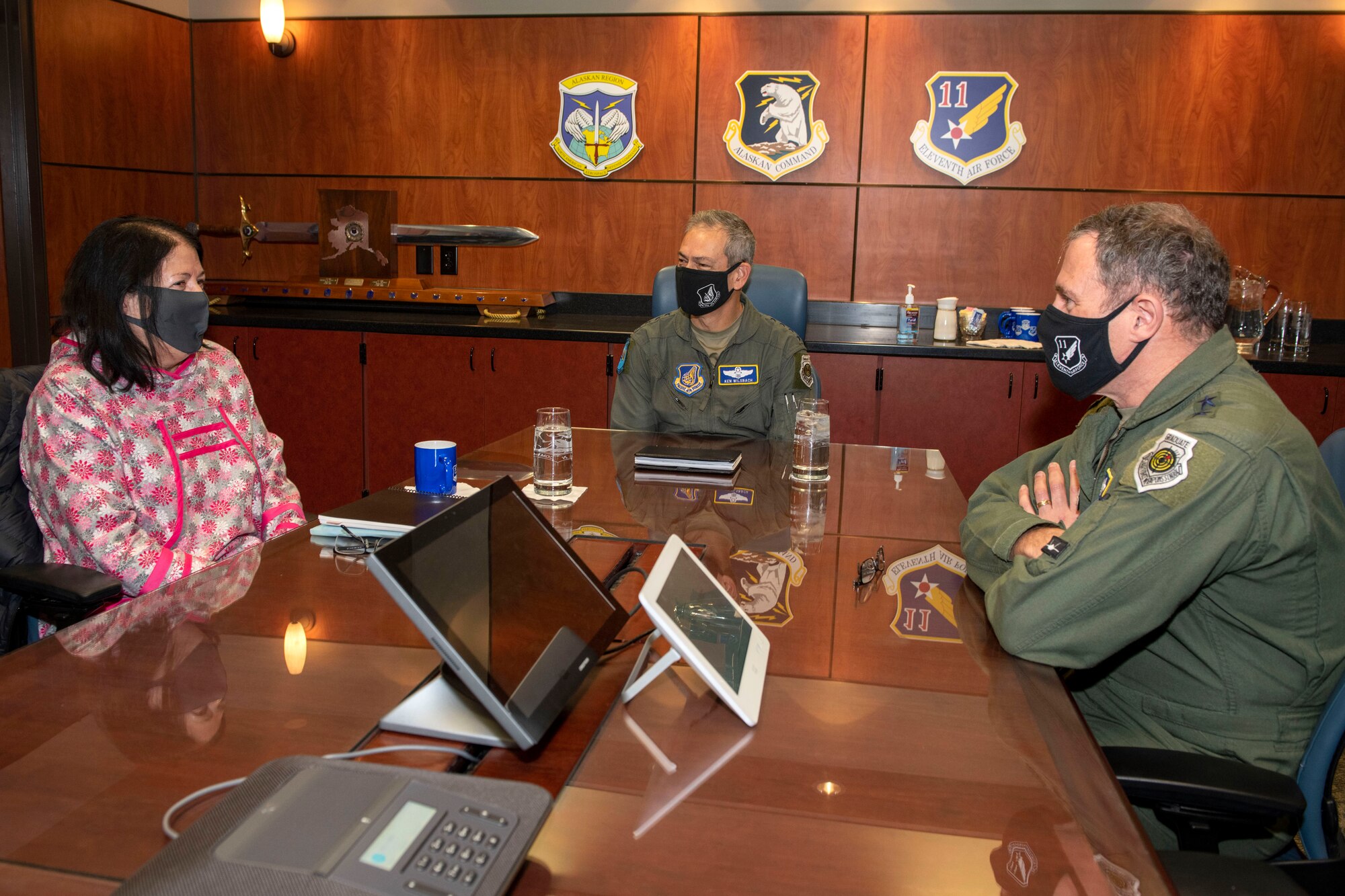 U.S. Air Force Gen. Kenneth Wilsbach, center, the Pacific Air Forces commander, talks to Julie Kitka, left, president of the Alaska Federation of Natives, and U.S. Air Force Lt. Gen. David Krumm, right, the Eleventh Air Force commander, about the relationship between the military and the Alaska Native community at Joint Base Elmendorf-Richardson, Alaska, Feb. 16, 2021. PACAF leadership conducted an immersion tour of JBER to learn about the installation's role in readiness and defense in the Arctic as well as how the base remains poised for the future through innovative ideas.