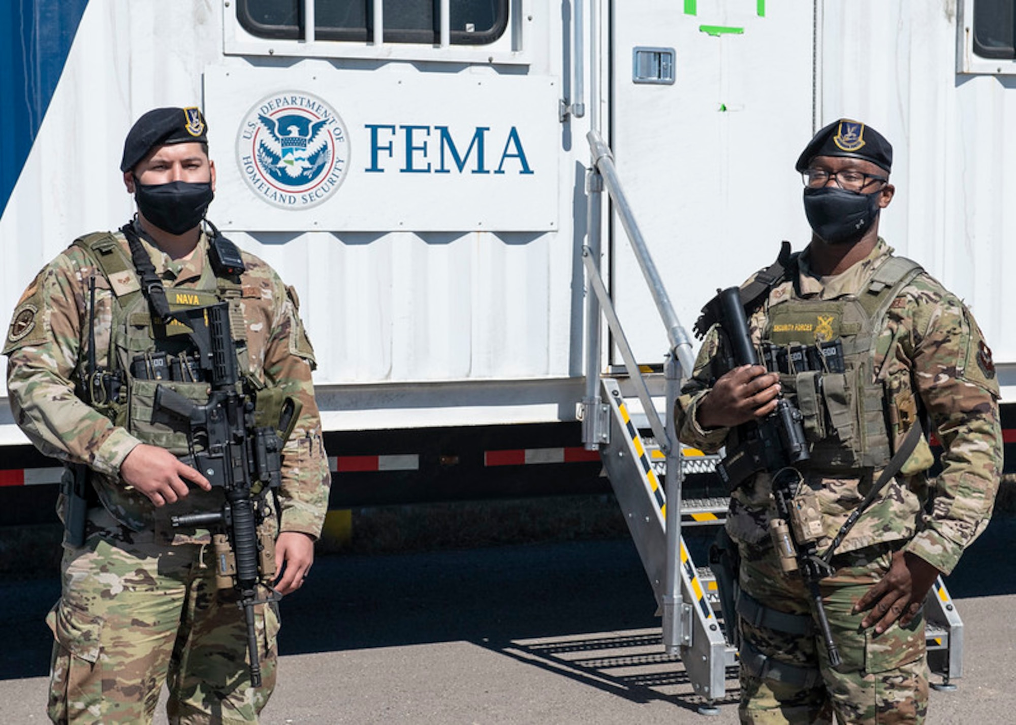 Staff Sgt. Saul Nava and Tech Sgt. Andre Bolden, 902d Security Forces Squadron provide security for the Federal Emergency Management Agency at Joint Base San Antonio-Randolph’s Seguin Auxiliary Airfield, Seguin, Texas, Feb. 20, 2021.