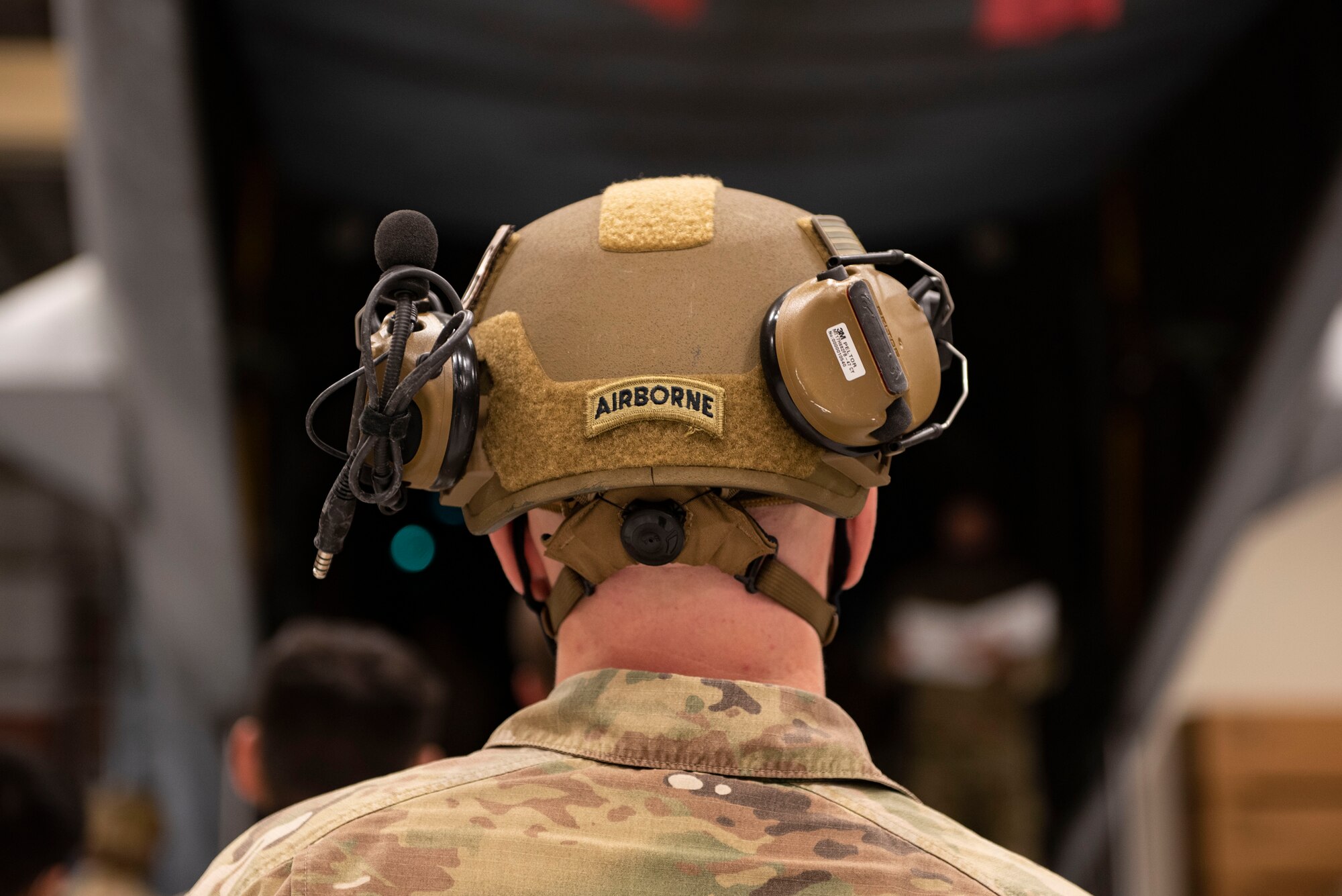 A photo of an Airman watching a demonstration.