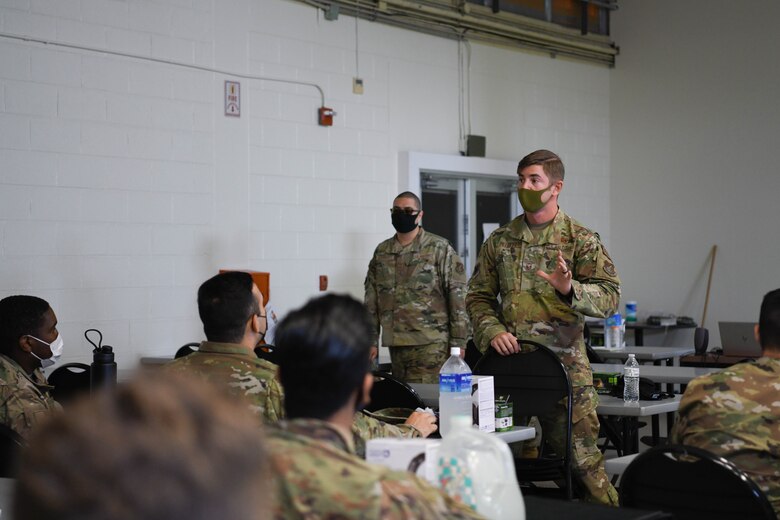 U.S. Air Force Master Sgt. Tyler Pillmore, the Agile Combat Employment section chief from the 18th Wing, briefs the Multi-Capable Airmen course participants on the next scheduled training at Kadena Air Base, Japan, Feb. 25, 2021. The MCA course broadens Airmen’s skills beyond their current Air Force specialty code, supporting the Agile Combat Employment concept.