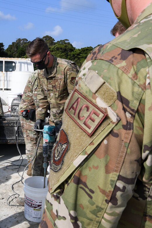 U.S. Air Force Senior Airman Hayden McAbee, an F-15 avionics technician from the 44th Aircraft Maintenance Unit, mixes mortar for expedient spall repair during a Multi-Capable Airmen course exercise, at Kadena Air Base, Japan, Feb. 25, 2021. Expedient spall repair quickly repairs holes enabling jets to continue to use the airfield.