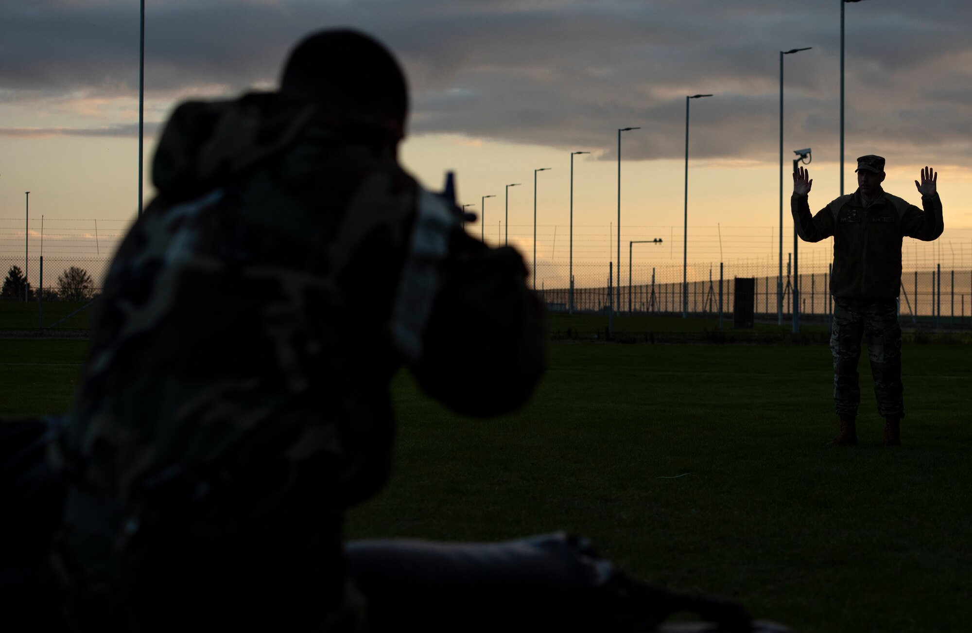 A U.S. Air Force Airman assigned to the 48th Civil Engineering Squadron assumes a defensive fighting position during a readiness training at Royal Air Force Feltwell, Nov. 4, 2020. CES Airmen must maintain the ability to operate in all contingency environments through teamwork and practical application. (U.S. Air Force photo by Airman 1st Class Jessi Monte)