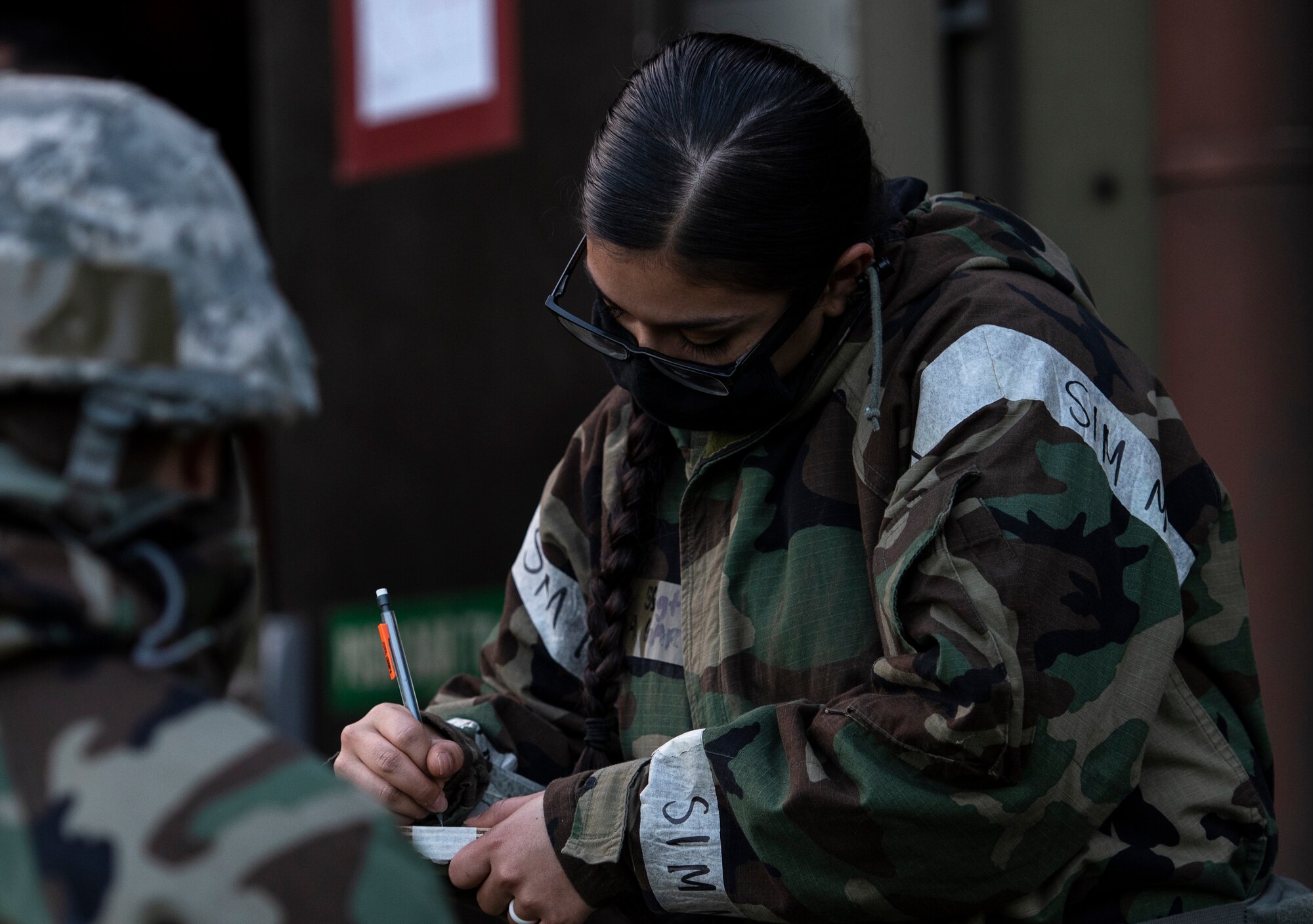 A U.S. Air Force Staff Sgt. Rebecca Garcia, 48th Civil Engineering Squadron engineering craftsman, prepares for post-attack reconnaissance sweeps during a readiness training at Royal Air Force Feltwell, Nov. 4, 2020. CES Airmen must maintain the ability to operate in all contingency environments through teamwork and practical application. (U.S. Air Force photo by Airman 1st Class Jessi Monte)