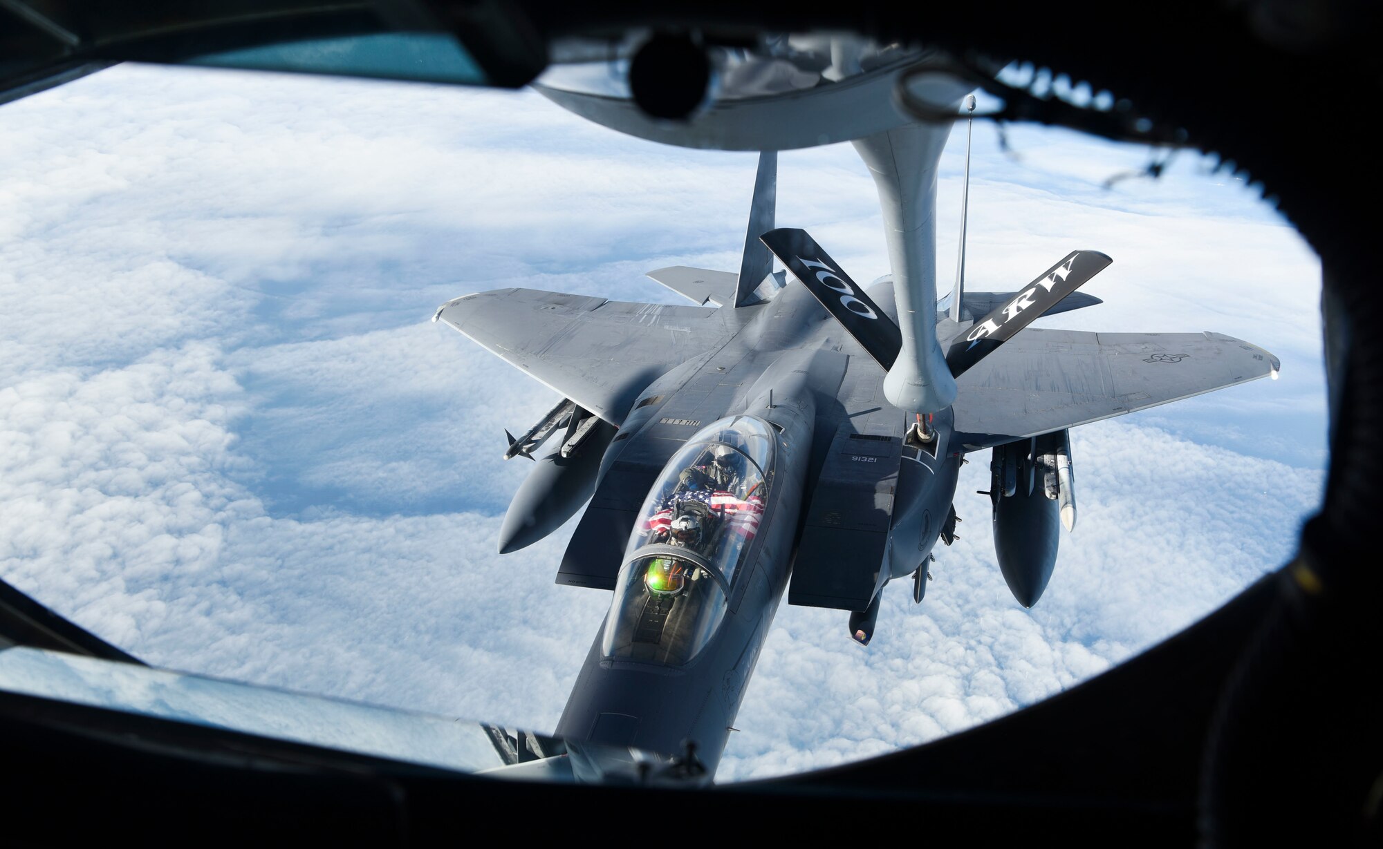 A U.S. Air Force F-15E Strike Eagle aircraft assigned to the 48th Fighter Wing, Royal Air Force Lakenheath, England, receives fuel from a KC-135 Stratotanker aircraft assigned to the 100th Air Refueling Wing from RAF Mildenhall, England, Feb. 24, 2021. Four F-15E fighter jets participated in the Estonian Independence Day fly-over, joining L-39 training jets and a M-28 transport aircraft of the Estonian Air Force, Eurofighter Typhoon fighter jets from the German Air Force deployed to Estonia as part of the Baltic Air Policing Mission, and Eurofighter Typhoon fighter jets from the Italian Air Force deployed as part of the Baltic Air Policing Mission in Lithuania. (U.S. Air Force Photo by Airman 1st Class David C Busby)