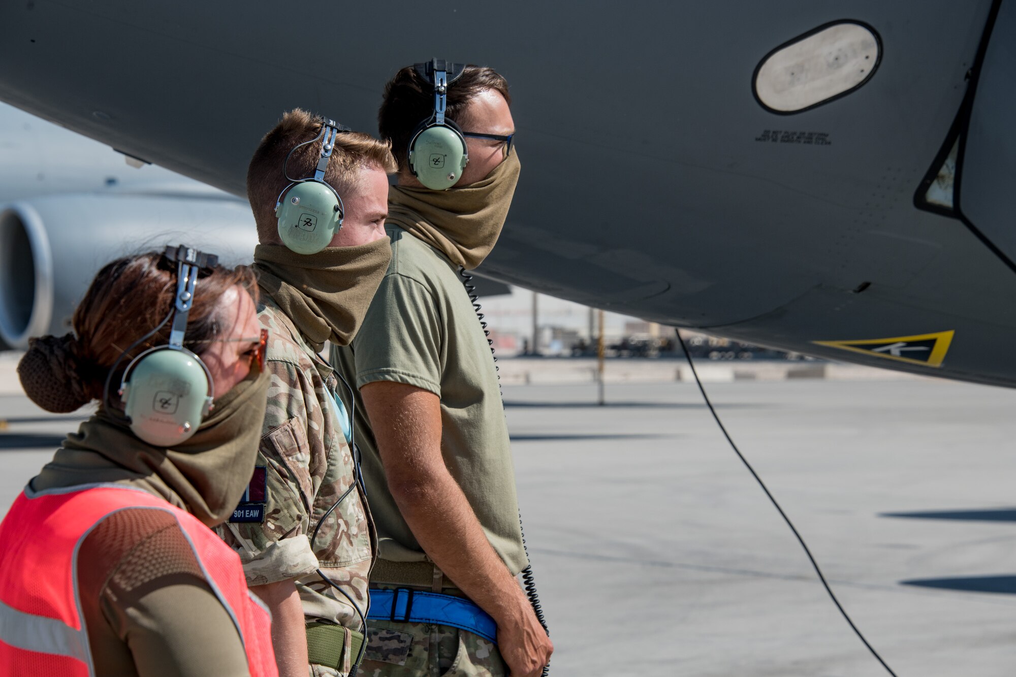 Royal Air Force and U.S. Air Force Airmen stand in a line