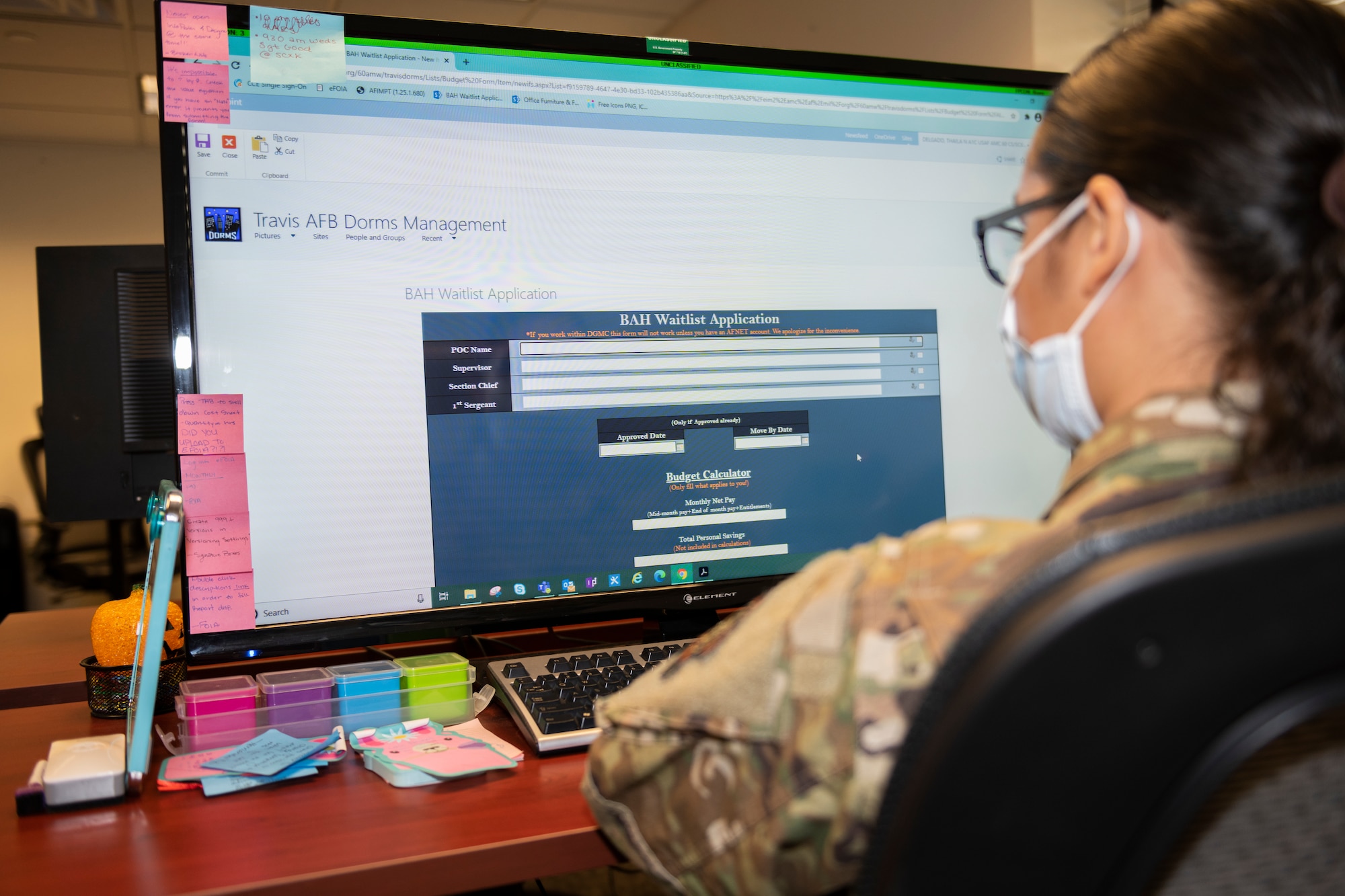 U.S. Airman 1st Class Thaila Delgado, 60th communications Squadron knowledge management craftsman, access’s the basic allowance for housing waitlist application website Feb. 18, 2020, at Travis Air Force Base, California. Delgado drafted and coordinated with multiple base agencies to create a site that helps Airmen line up their budgeting, in efforts to help them move out of the base dorms more easily. (U.S. Air Force photo by Senior Airman Cameron Otte)