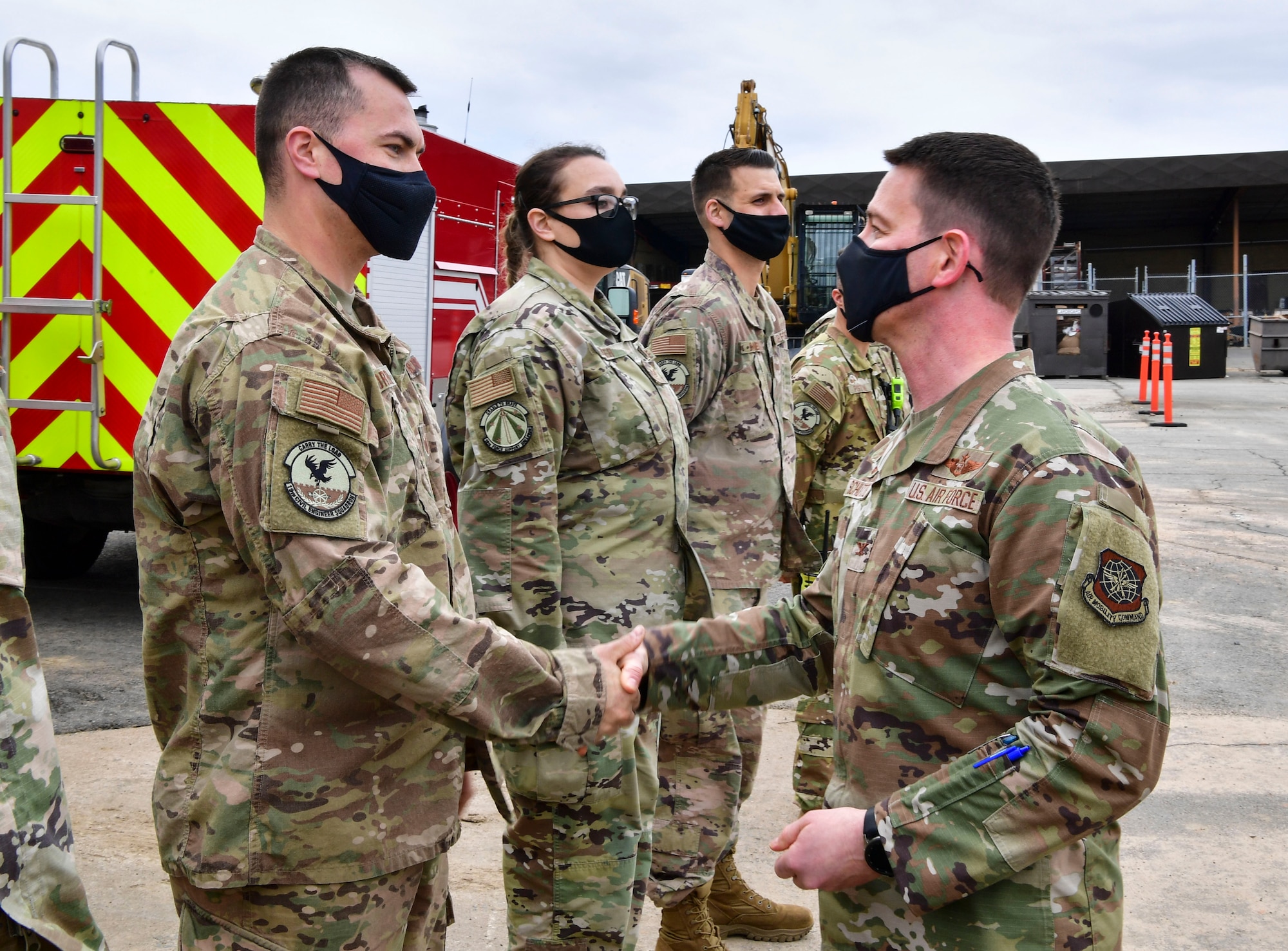 A group of Airmen are recognized