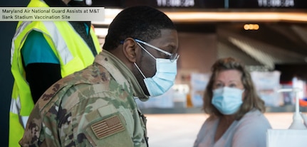 U.S. Air Force Airman Johnnie Boggs of the 175th Medical Group works at a computer terminal entering a patient's information before they receive the COVID-19 vaccine at M&T Bank Stadium in Baltimore, Md., Feb. 25, 2021. The Maryland National Guard is supporting Maryland's COVID-19 vaccination initiative.