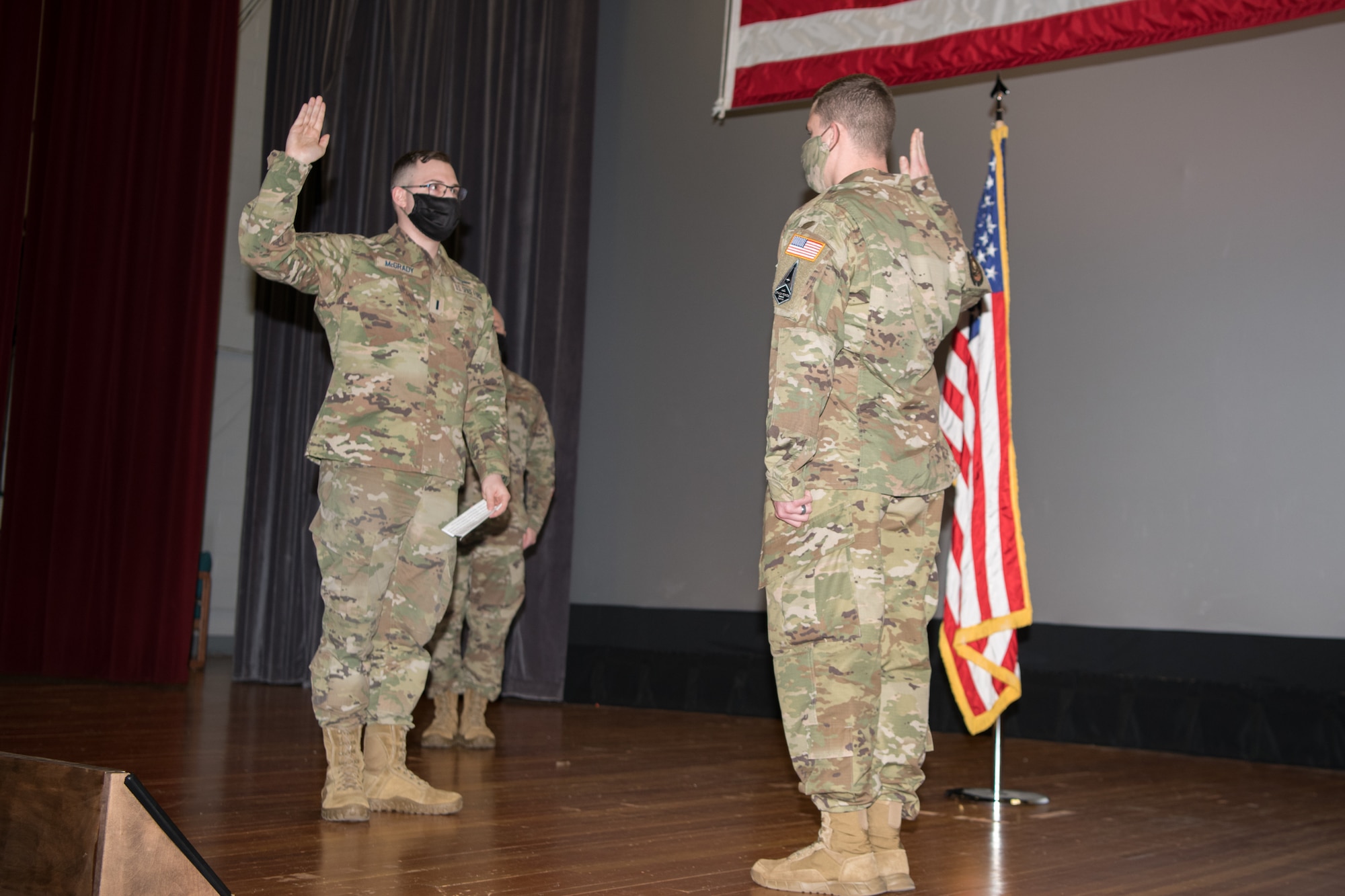 As his first act as a newly commissioned United States Space Force officer, 1st Lt. John McGrady, 436th Communications Squadron cyber operations flight commander, administers the oath of enlistment to Staff Sgt. David Diehl II, 436th Communications Squadron noncommissioned officer in charge of wing cybersecurity, at Dover Air Force Base, Delaware, Feb. 12, 2021. The Airmen applied to join the Space Force in 2020 and were accepted in early 2021. (U.S. Air Force photo by Mauricio Campino)
