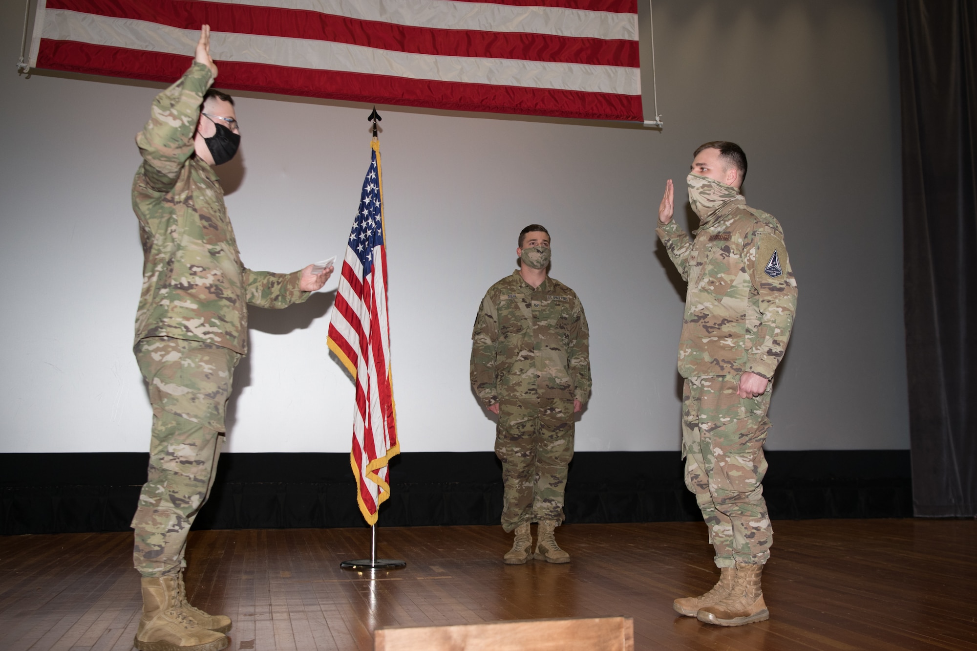 1st Lt. John McGrady, 436th Communications Squadron cyber operations flight commander, administers the oath of enlistment to Senior Airman Michael Hack, 436th Communications Squadron client systems technician, at Dover Air Force Base, Delaware, Feb. 12, 2021. McGrady’s first act as a newly commissioned Space Force officer was to administer the oath of enlistment for two Airmen in his squadron who were also accepted into the U.S. Space Force. (U.S. Air Force photo by Mauricio Campino)