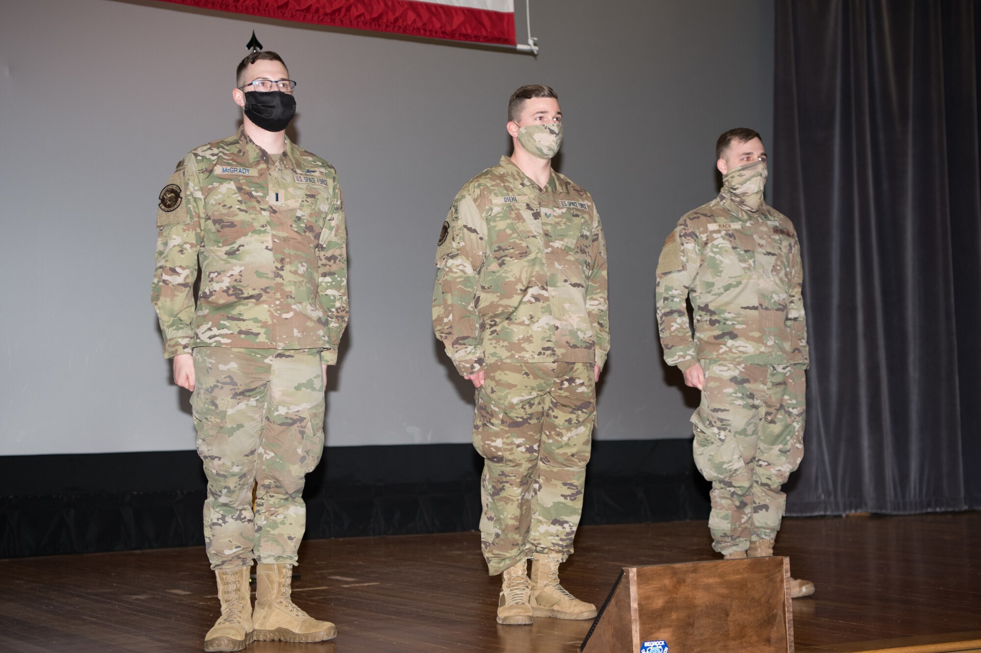 From left, 1st Lt. John McGrady, 436th Communications Squadron cyber operations flight commander, Staff Sgt. David Diehl II, 436th Communications Squadron noncommissioned officer in charge of wing cybersecurity and Senior Airman Michael Hack, 436th Communications Squadron client systems technician, stand at the conclusion of their commissioning and enlistment ceremony at Dover Air Force Base, Delaware, Feb. 12, 2021. The three members of Team Dover became the base’s first Space Force Guardians and will be reassigned to a Space Force command later this year. (U.S. Air Force photo by Mauricio Campino)