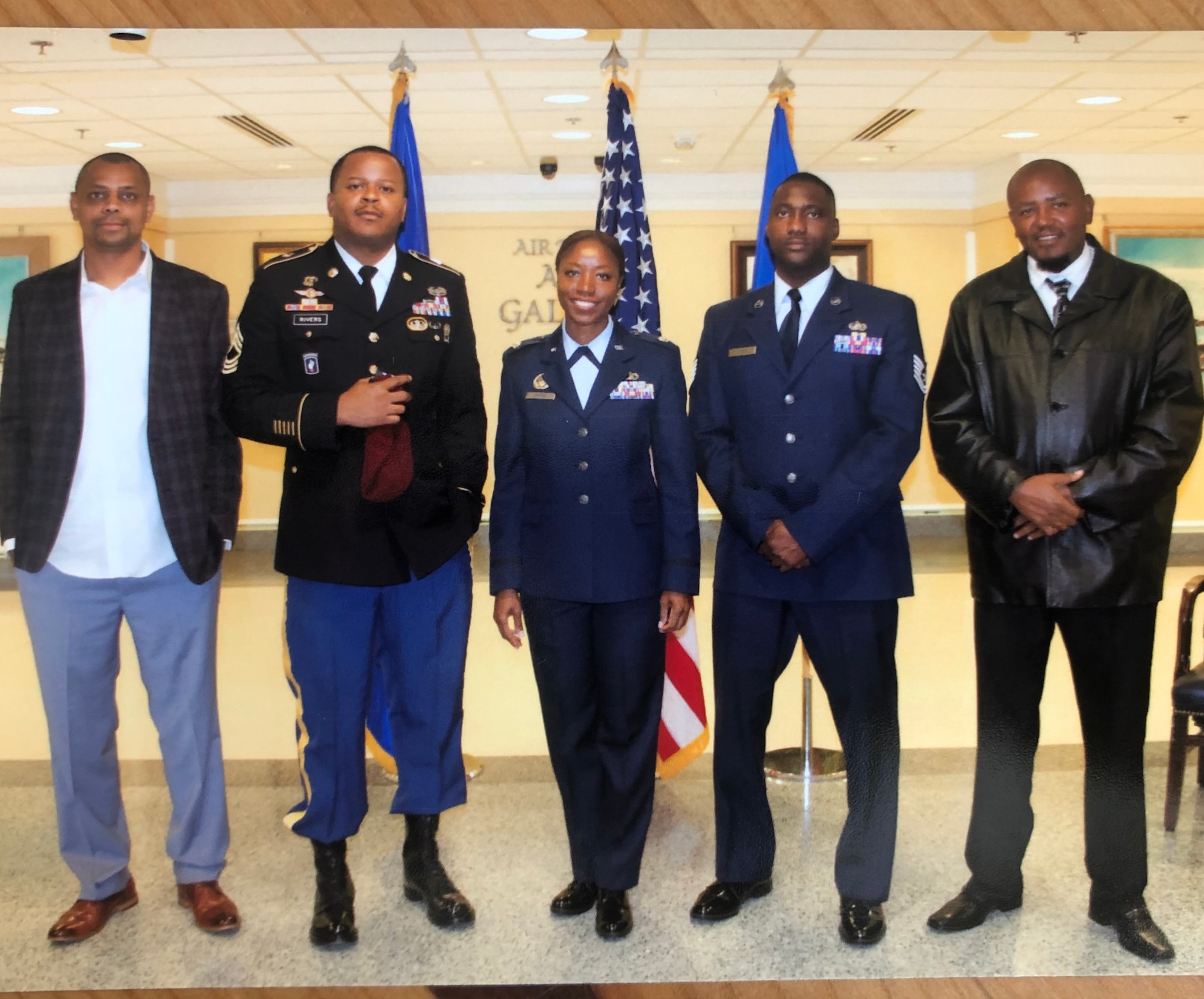 Lt. Col. Miriam Carter poses for a photo with her brothers (from left to right) Gerod Baldeo, MSG Ephraim Rivers, TSgt Collinsworth Ayers and Solomon Rivers during her promotion ceremony at the Pentagon, September 2018. (Courtesy Photo)