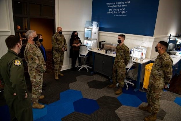 Airmen from the Palmetto Spark Innovation Lab give a briefing about the innovative ideas they are bringing to the base to Maj. Gen. Mark Camerer, U.S. Air Force Expeditionary Center commander, and Chief Master Sgt. Anthony W. Green, USAF Expeditionary Center command chief, at Joint Base Charleston, S.C., Feb. 9, 2021. Camerer, along with Green toured the base to get a firsthand look at Team Charleston’s capabilities and accomplishments.