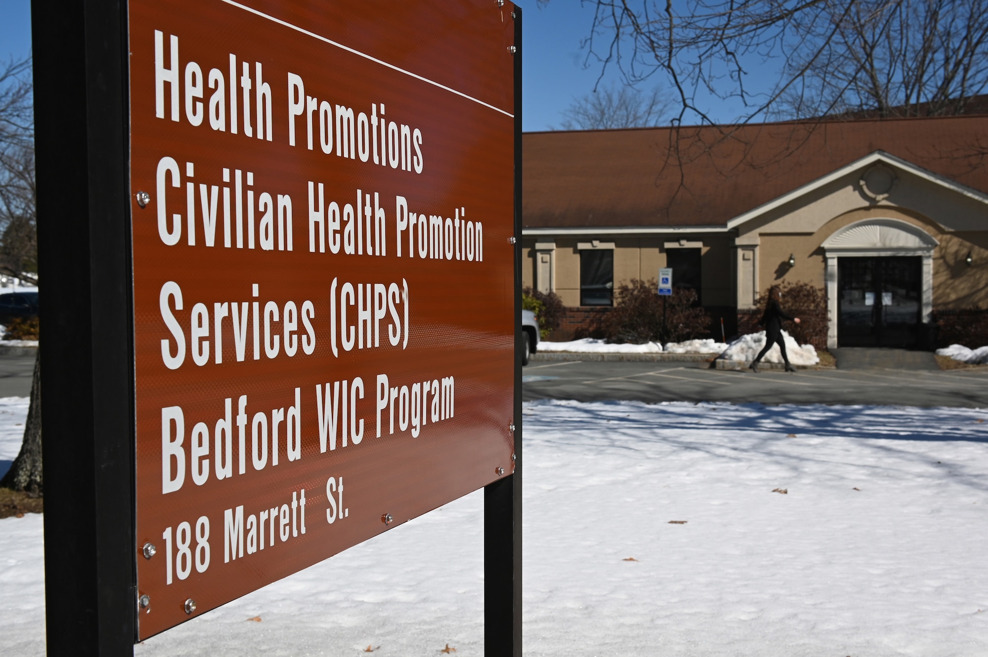 Britini Bredeweg, installation Civilian Health Promotion Services coordinator, walks into the CHPS facility at Hanscom Air Force Base, Mass., Feb. 26. Recently, CHPS has resumed some in-person services at the Hanscom-facility by appointment only. (U.S. Air Force photo by Todd Maki)