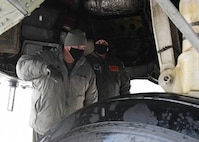 Honorable Sean Sipma, mayor of Minot, North Dakota and Lt. Colonel Brad Haynes, 5th Operations Support Squadron commander, perform preflight inspections of a B-52 Feb. 24, 2021 at Minot Air Force Base, North Dakota. Minot AFB often gives incentive flights to strengthen relationships between Team Minot and Minot township.