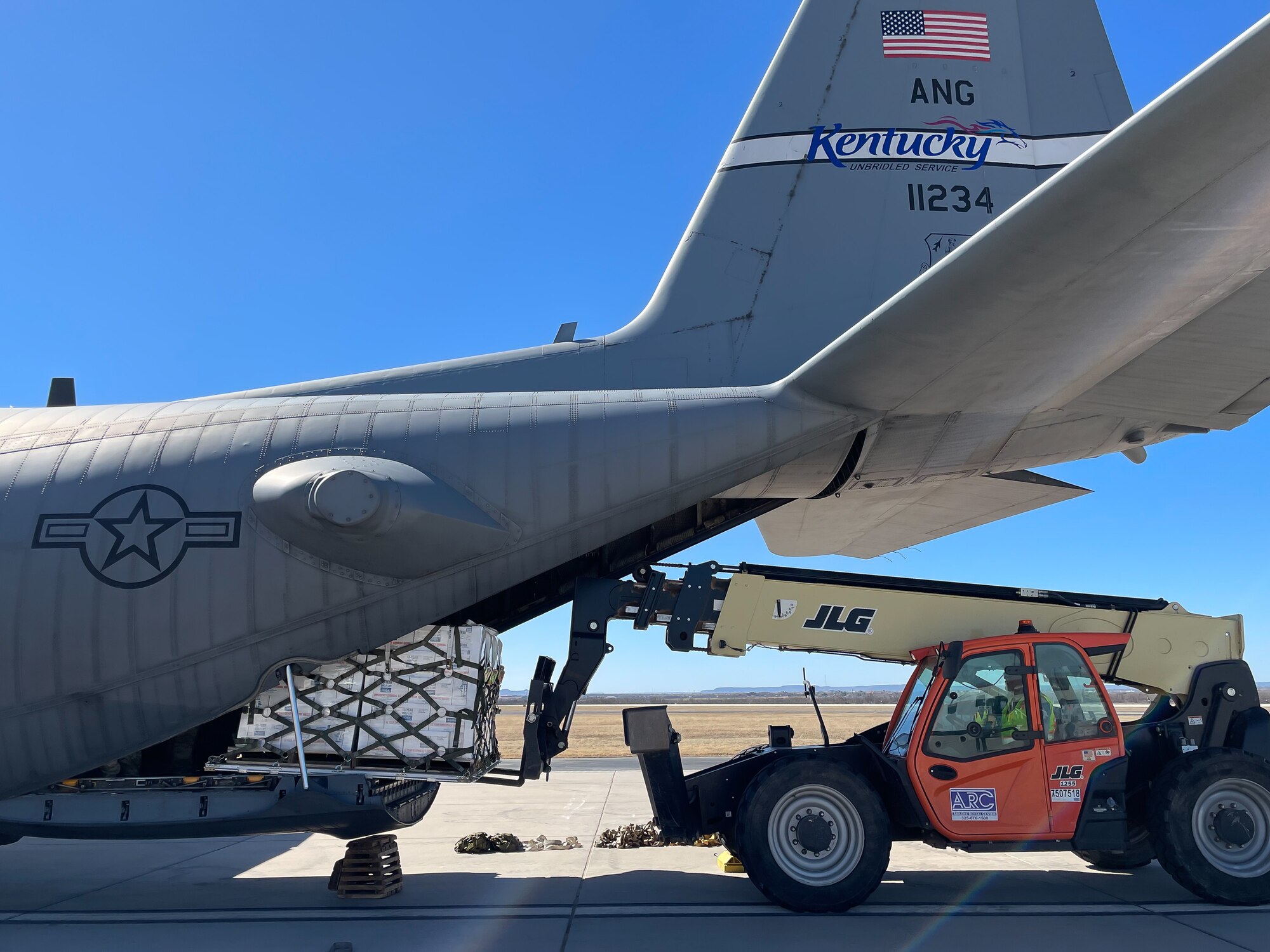 Airmen from the Kentucky Air National Guard deliver relief supplies to Abilene, Texas Feb. 23, 2021,  following a winter storm that left millions without electricity or potable water for days. The supplies, flown aboard a C-130 Hercules aircraft from the Louisville, Kentucky-based 123rd Airlift Wing, include food and bottled water. (U.S. Air National Guard photo)