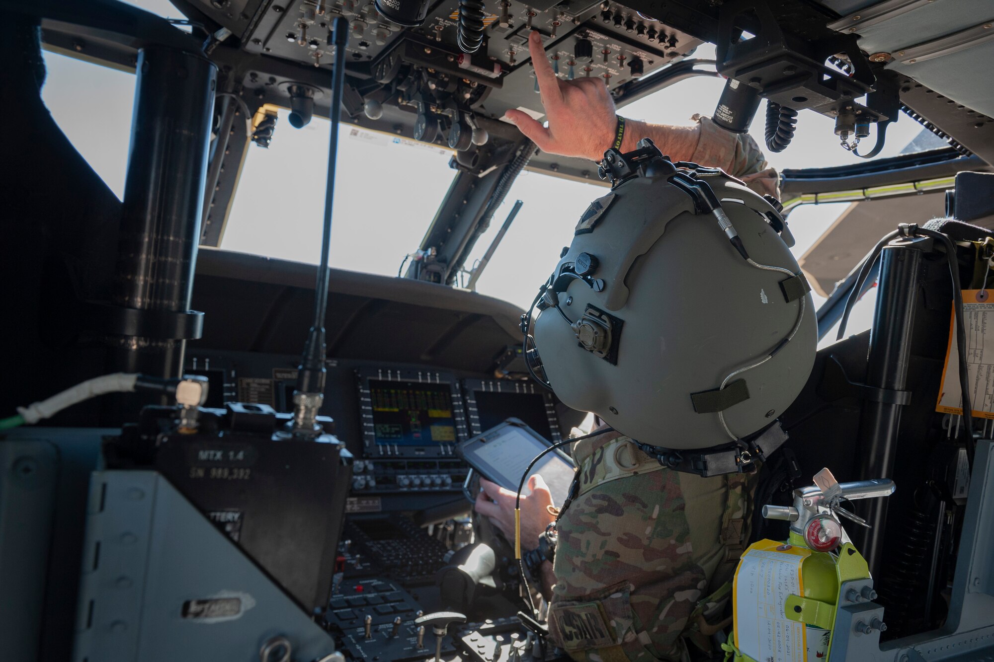 Photo of an Airman performing a pre-flight check