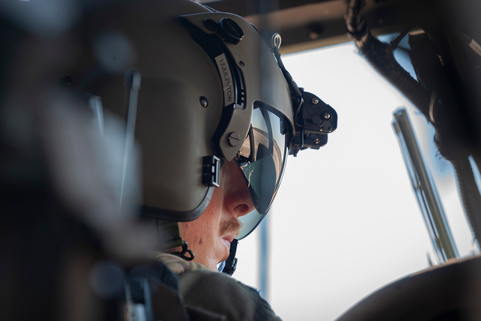Photo of an Airman looking at controls