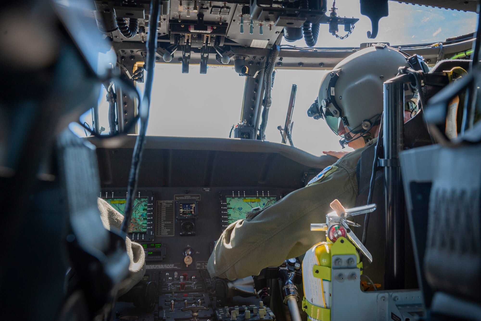 Photo of an Airman pressing a control button
