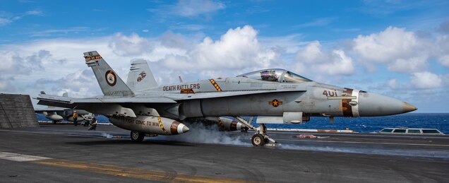 210219-N-JX182-1148 PACIFIC OCEAN (Feb. 19, 2021) An F/A-18C Hornet, from the “Death Rattlers” of Marine Fighter Attack Squadron (VMFA) 323, launches off the flight deck of the USS Nimitz (CVN 68). Nimitz, flagship of Nimitz Carrier Strike Group, is currently conducting routine operations in U.S. Third Fleet.