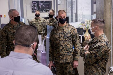 Lt. Gen. Karsten Heckl, Brig. Gen. Daniel B. Conley, and Col. Charles B. Dockery review the efficiency of the Marine Corps Air Station Miramar microgrid power plant during the Energy Resilience Readiness Exercise at MCAS Miramar, San Diego, California, Feb. 18, 2021. Heckl serves as the I Marine Expeditionary Unit commanding general; Conley serves as the Marine Corps Installations West - Marine Corps Base Camp Pendleton commanding general; and Dockery serves as the MCAS Miramar commanding officer. The microgrid is a $20-million electrical backup system, which provides the installation with up to 14 days of energy resilience. (U.S. Marine Corps photo by Sgt. Jorge A. Rosales)