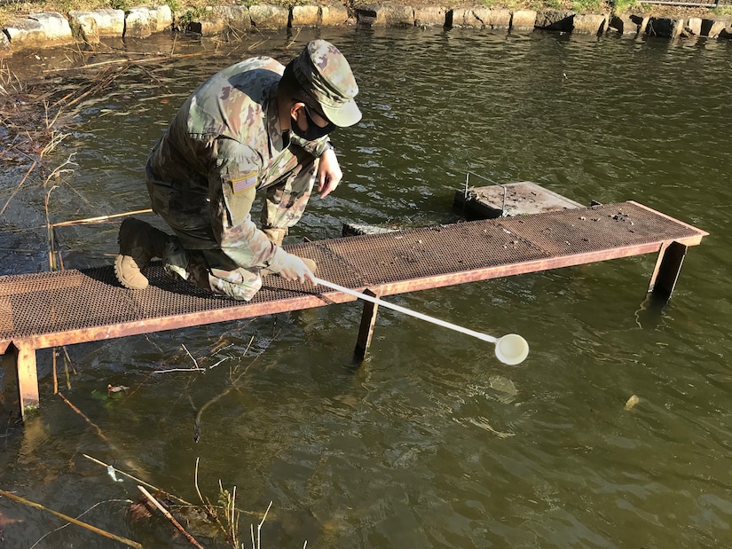 Staff Sgt. Matthew Pascual, noncommissioned officer in charge of entomology for Public Health Command-Pacific in Japan, samples for mosquito larvae during a vector surveillance survey on Camp Zama, Japan, for mosquito egg larvae, Feb. 25, 2021. Collecting vector samples allows for PHC-P scientists to analyze areas of interest for potential vector-borne diseases that could impact the health of the force.