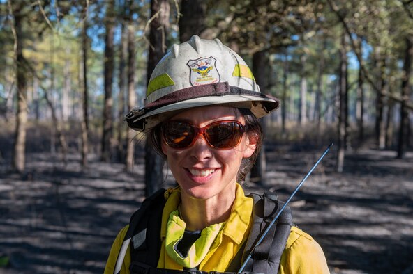 A photo of a woman smiling.