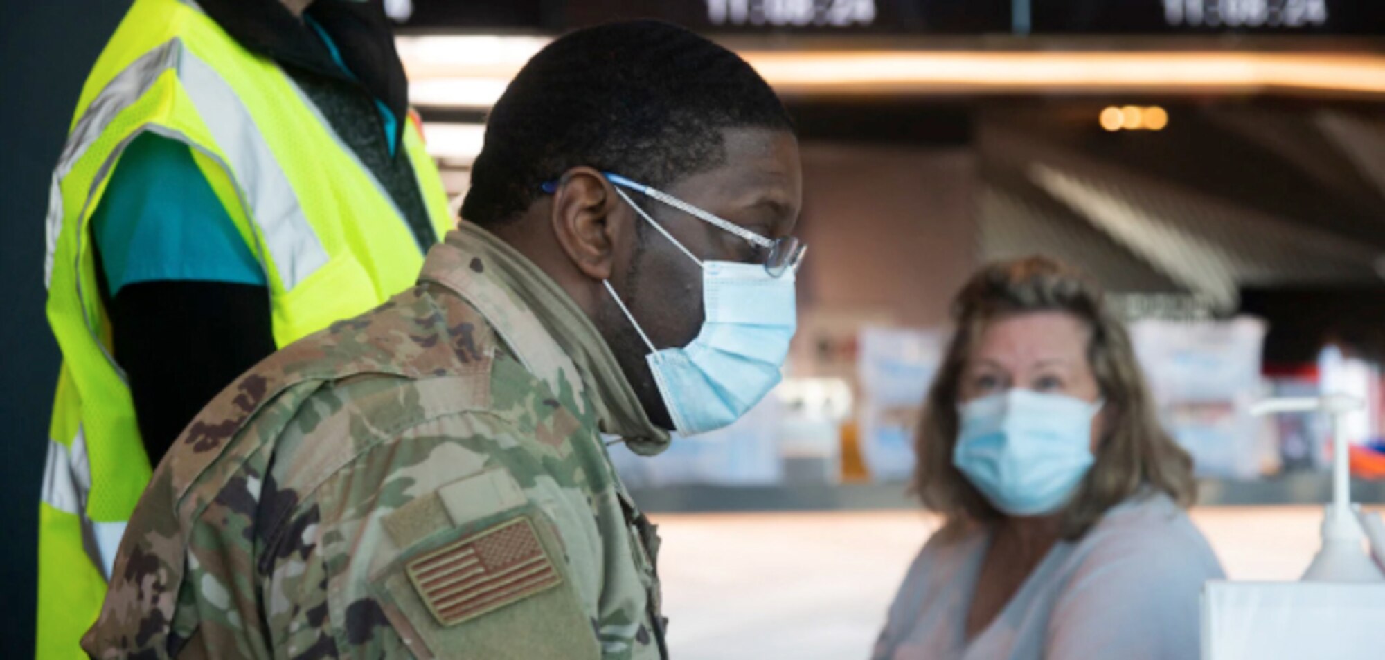 U.S. Air Force Airman Johnnie Boggs of the 175th Medical Group works at a computer terminal entering a patient's information before they receive the COVID-19 vaccine at M&T Bank Stadium in Baltimore, Md., Feb. 25, 2021. The Maryland National Guard is supporting Maryland's COVID-19 vaccination initiative.