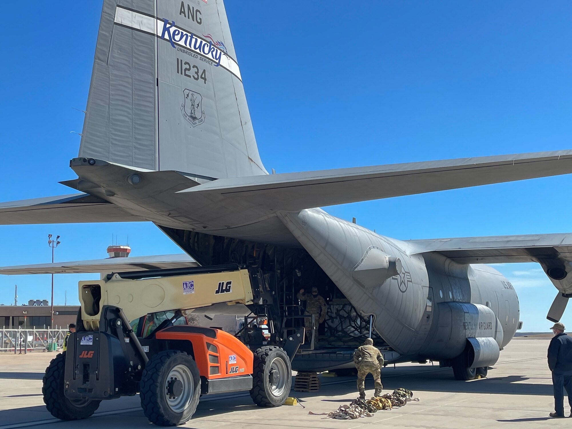 Airmen from the Kentucky Air National Guard deliver relief supplies to Abilene, Texas Feb. 23, 2021,  following a winter storm that left millions without electricity or potable water for days. The supplies, flown aboard a C-130 Hercules aircraft from the Louisville, Kentucky-based 123rd Airlift Wing, include food and bottled water. (U.S. Air National Guard photo)