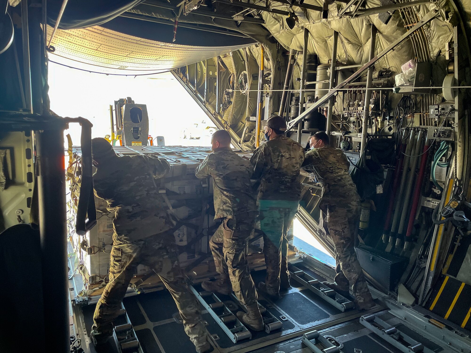 Airmen from the Kentucky Air National Guard deliver relief supplies to Abilene, Texas Feb. 23, 2021,  following a winter storm that left millions without electricity or potable water for days. The supplies, flown aboard a C-130 Hercules aircraft from the Louisville, Kentucky-based 123rd Airlift Wing, include food and bottled water. (U.S. Air National Guard photo)