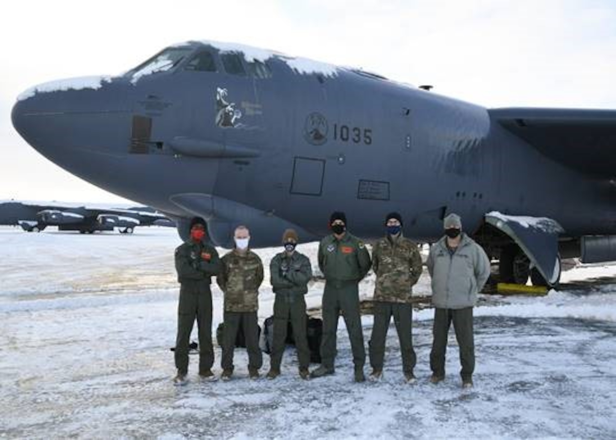 Honorable Sean Sipma, mayor of Minot, North Dakota, Lt. Colonel Brad Haynes, 5th Operations Support Squadron commander, and the flight crew pose in front of a B-52 Feb. 24, 2021 at Minot Air Force Base, North Dakota. Minot AFB often gives incentive flights to strengthen relationships between Team Minot and Minot township.