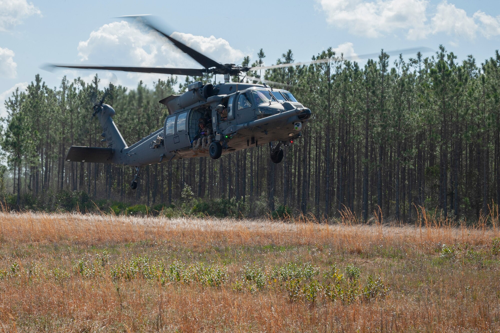 Photo of an HH-60W Jolly Green II preparing to land
