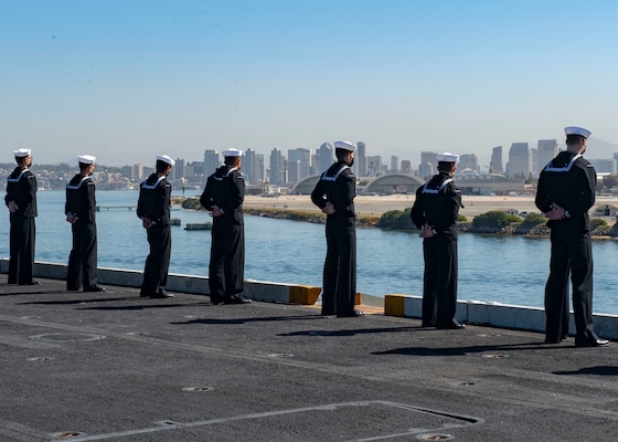 Sailors man the rails on the flight deck of the aircraft carrier USS Nimitz (CVN 68). Nimitz, part of Nimitz Carrier Strike Group, returned to Naval Base San Diego after a more than 10-month deployment.