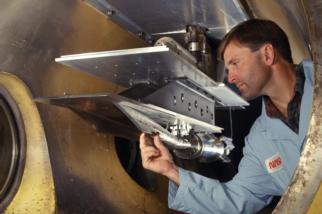 An engineer works on a hypersonic vehicle.