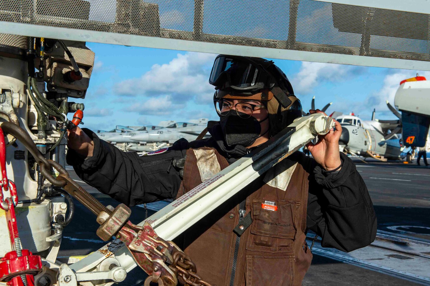 210228-N-OB471-1026 ATLANTIC OCEAN (Feb. 28, 2021) Airman Monica Araujo, from Davenport, Florida, inspects an E/A-18G Growler, attached to the "Zappers" of Electronic Attack Squadron (VAQ) 130, aboard the Nimitz-class aircraft carrier USS Dwight D. Eisenhower (CVN 69), in the Atlantic Ocean, February 28, 2021. Ike is on a routine deployment supporting U.S. national security interests in Europe and increasing theater cooperation and forward naval presence in the U.S. 6th fleet area of operations. (U.S. Navy photo by Mass Communication Specialist Seaman Jacob Hilgendorf/Released)