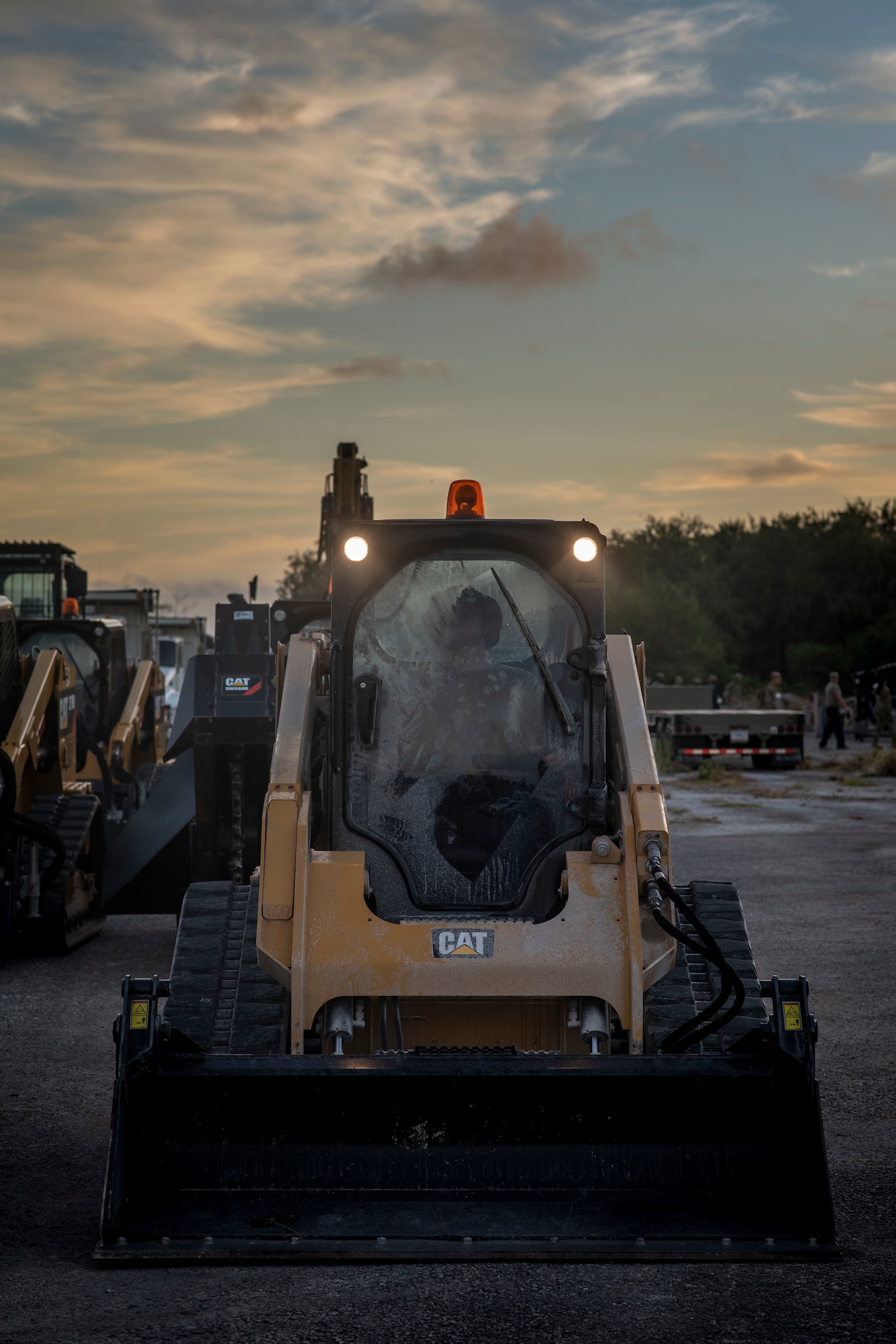 An Airmen with the 554th RED HORSE Squadron conducts an equipment check on his heavy machinery during a Rapid Airfield Damage Repair (RADR) Exercise at Andersen Air Force Base, Feb. 12, 2021.