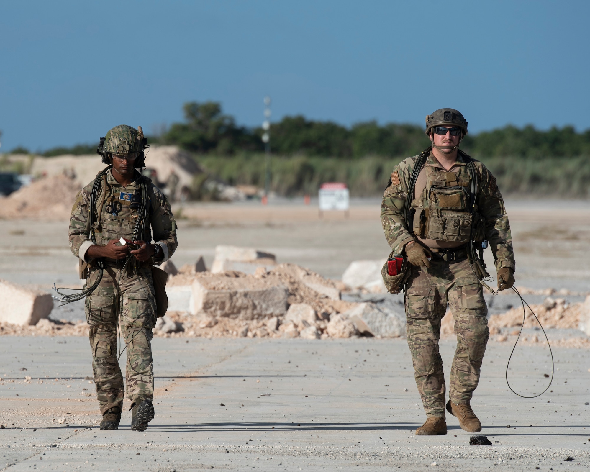 Airmen with the 554th RED HORSE Squadron prep an Airfield for repair during a Rapid Airfield Damage Repair (RADR) Exercise at Andersen Air Force Base
