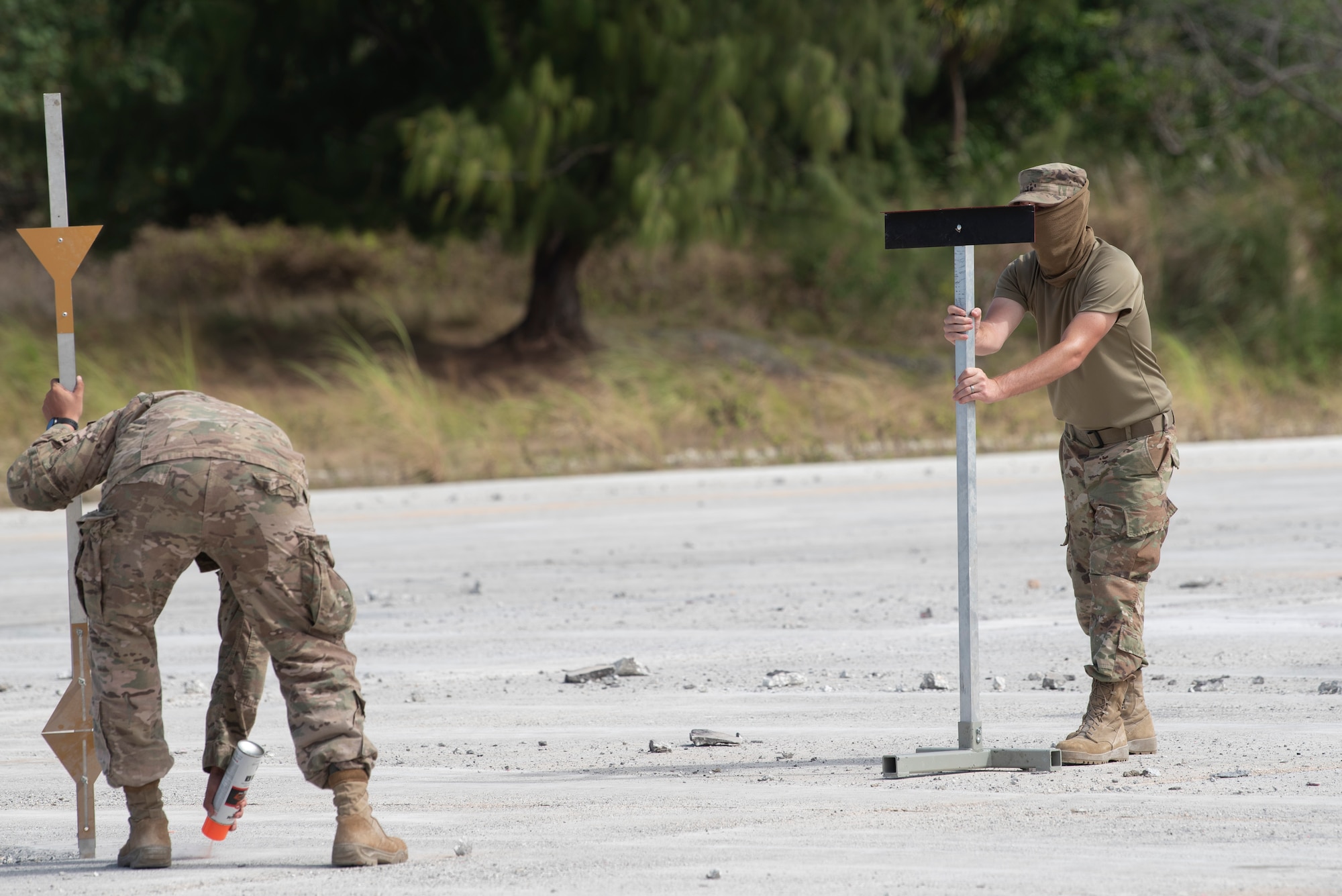 Airmen with the 554th RED HORSE Squadron prep an Airfield for repair during a Rapid Airfield Damage Repair (RADR) Exercise at Andersen Air Force Base