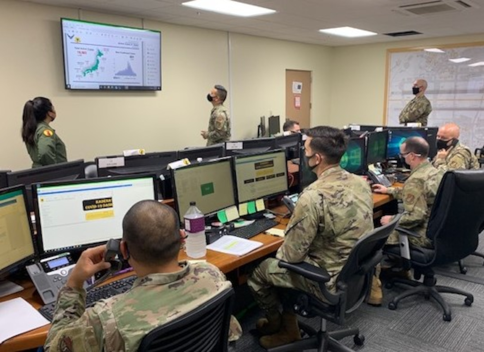 Members review slides during a briefing.