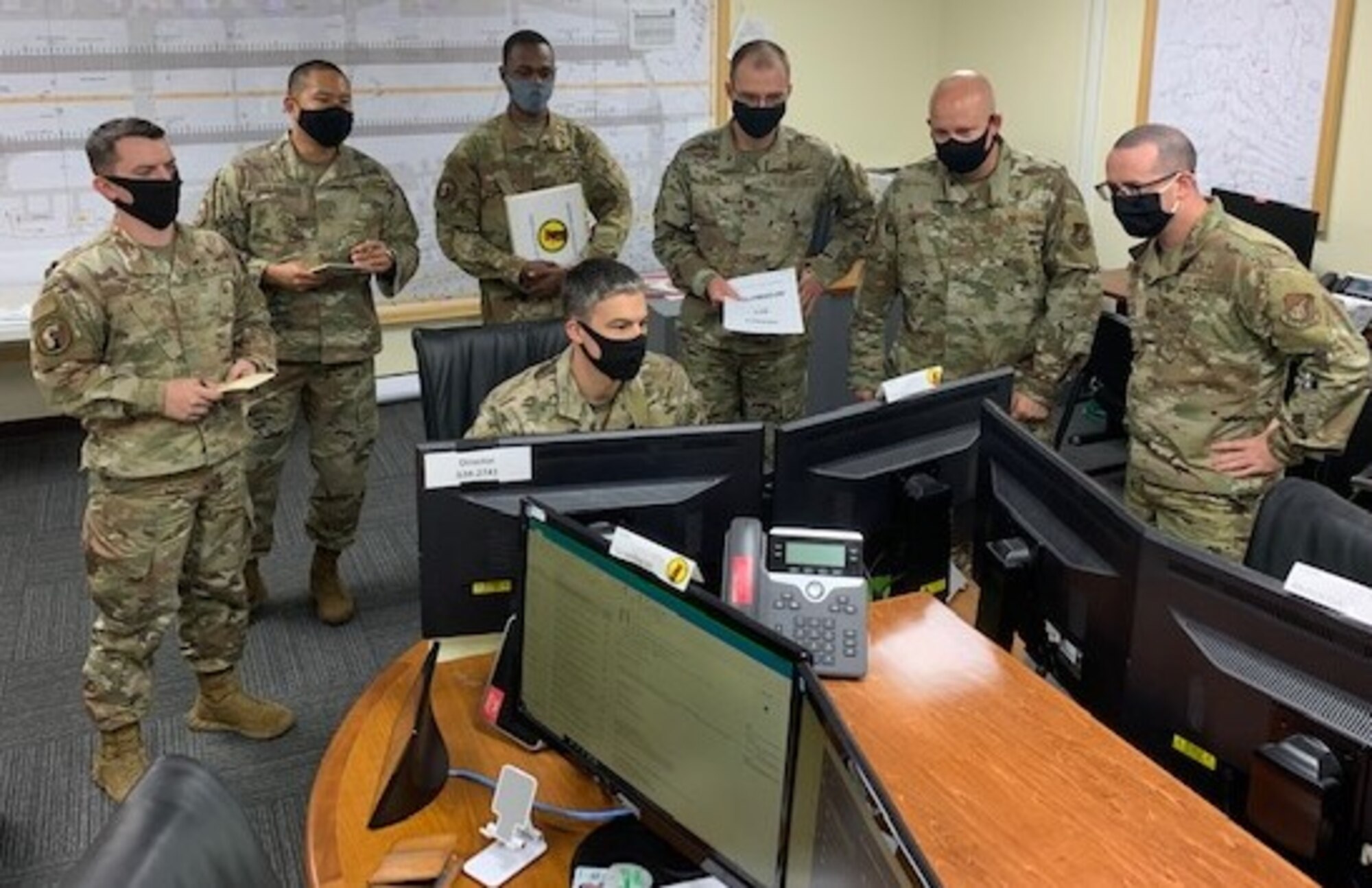 Members read an email.