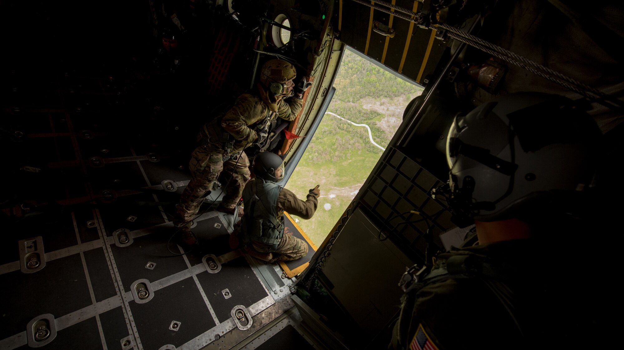 Pararescuemen and combat controllers from the Kentucky Air National Guard’s 123rd Special Tactics Squadron prepare for a jump from a 123rd Airlift Wing C-130 Hercules during the Precision Jumpmaster Course held at Camp Atterbury, Ind., May 13, 2020. The course is an upgrade training class for students who have attended formal jumpmaster training before. (U.S. Air National Guard photo by Phil Speck)